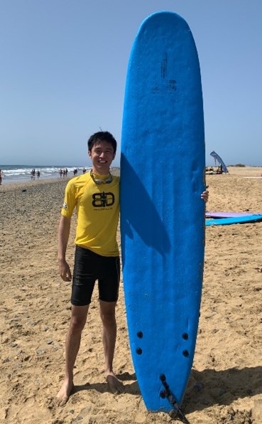 Allen with surfboard